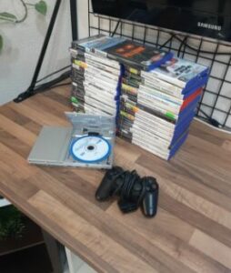 Lote de ps2 plata slim con 35 juegos